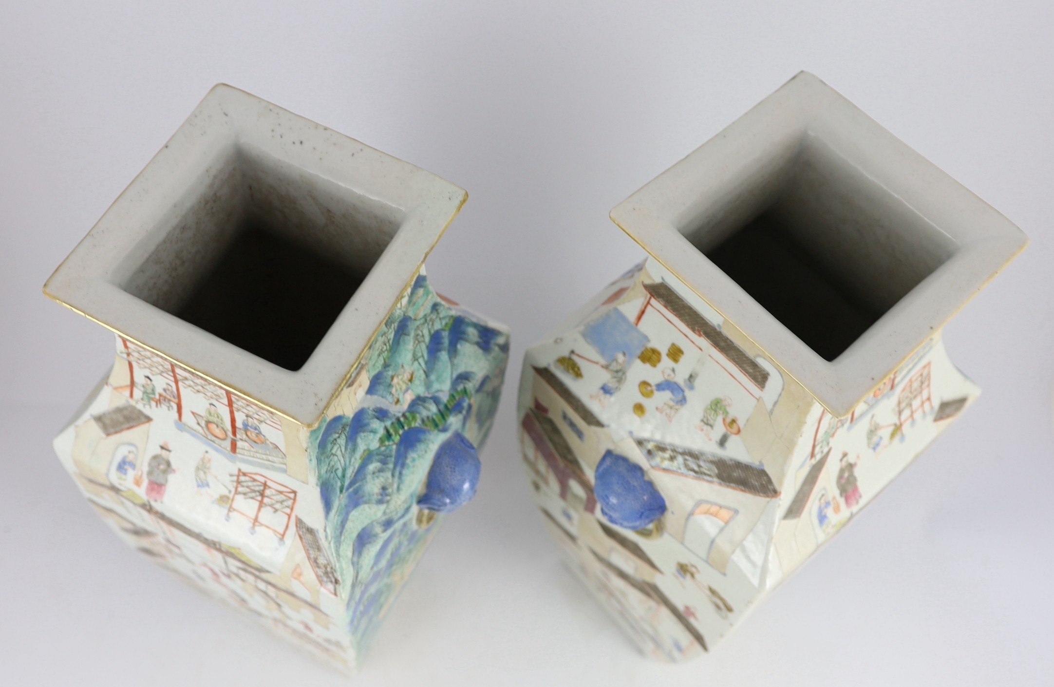 A pair of large Chinese famille rose fencai square baluster vases, 19th century, 53cm high, one corner of rim restored, some wear to enamels